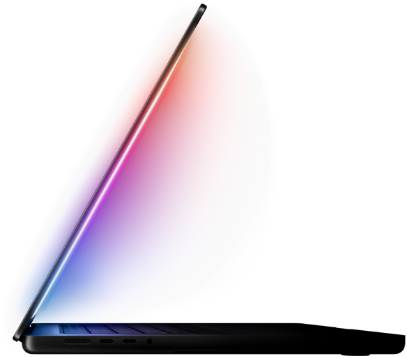 Un MacBook Pro con lo schermo leggermente aperto che emana una luce soffusa e multicolore, illuminando la tastiera